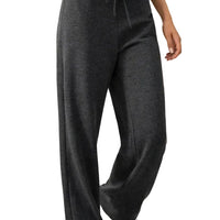 Person wearing dark gray bamboo sweatpants in a casual indoor setting
