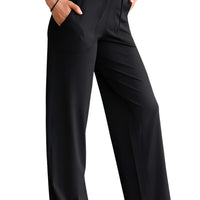 Person wearing black wide-leg pants in a modern indoor setting yoga pant