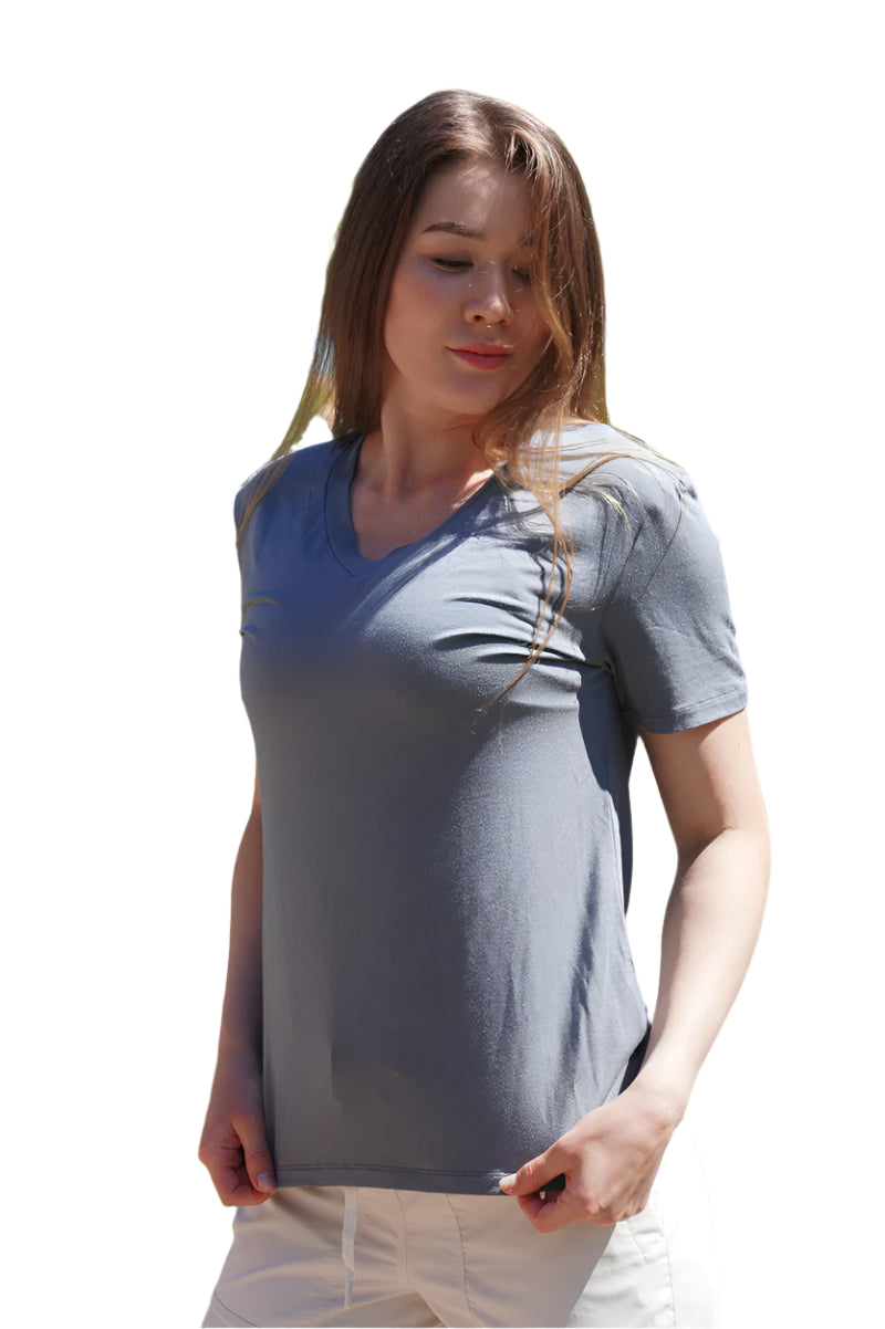 Woman wearing a gray t-shirt in a garden setting