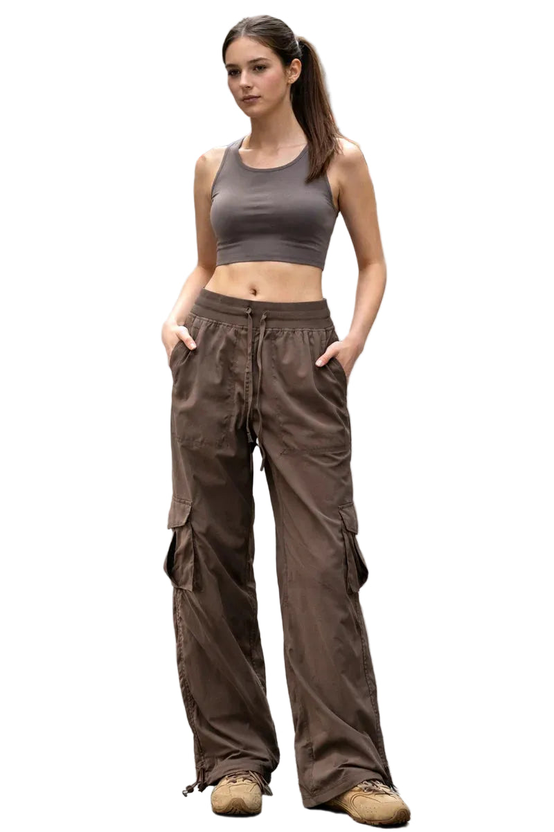 Woman wearing a brown athletic outfit on a city street