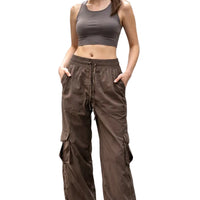 Woman wearing a brown athletic outfit on a city street